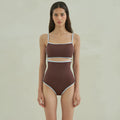 Brown women's one-piece triangle top swimsuit on hanger