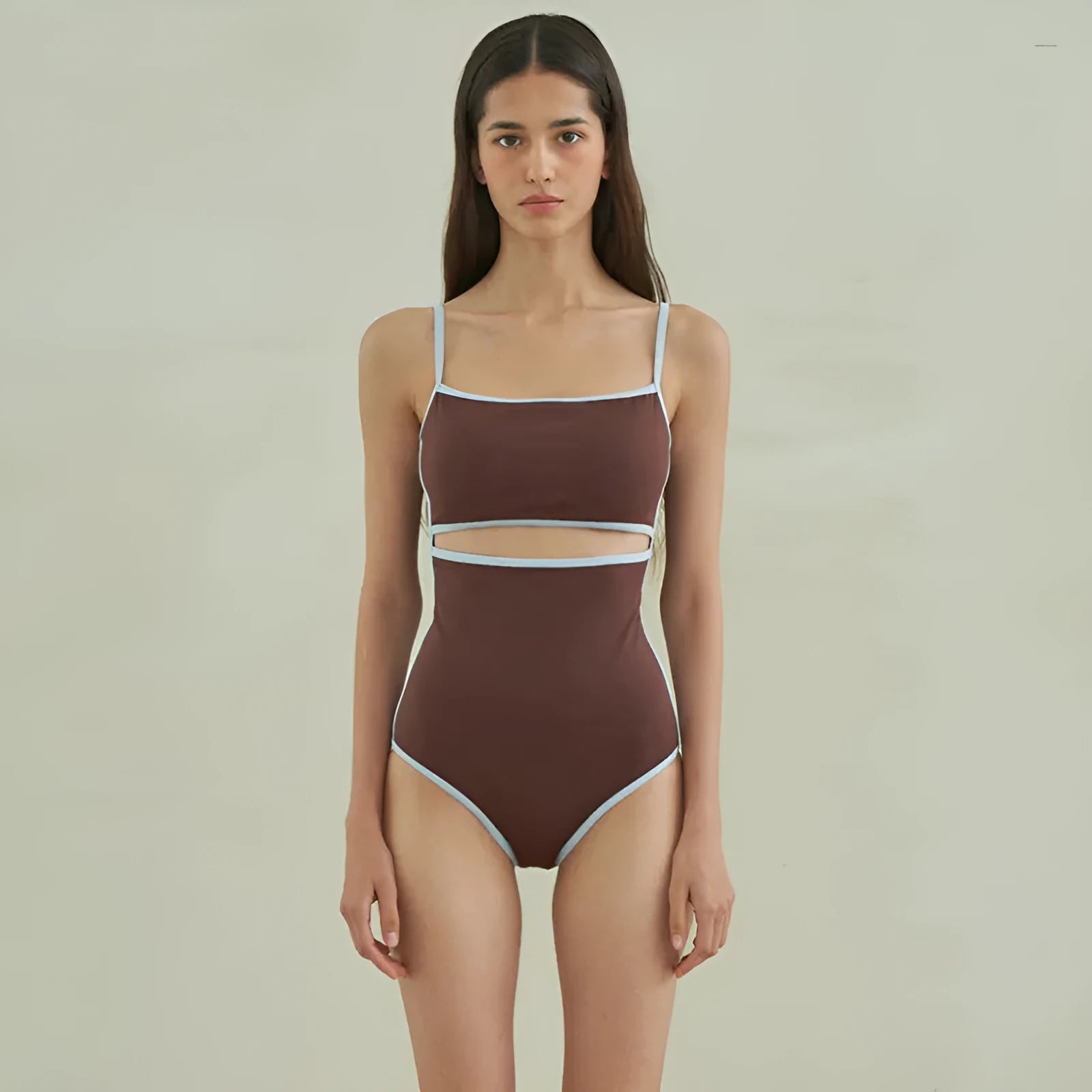 Brown women's one-piece triangle top swimsuit on hanger