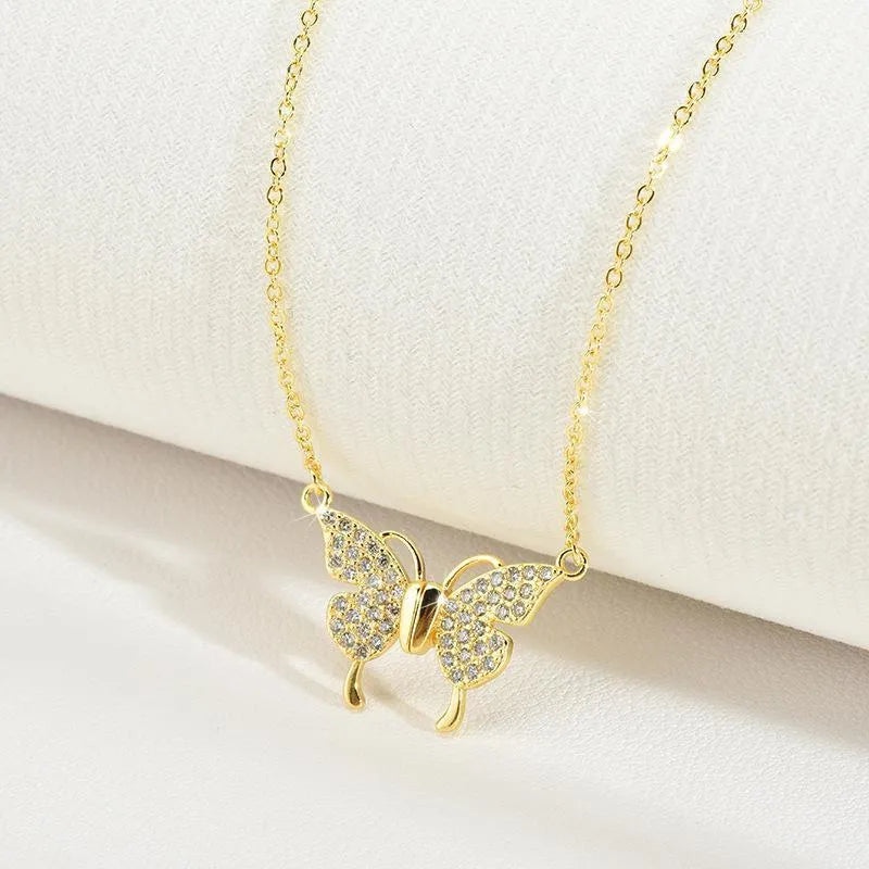 Women's titanium steel butterfly necklace with magnetic snap fastening in gold or silver finish