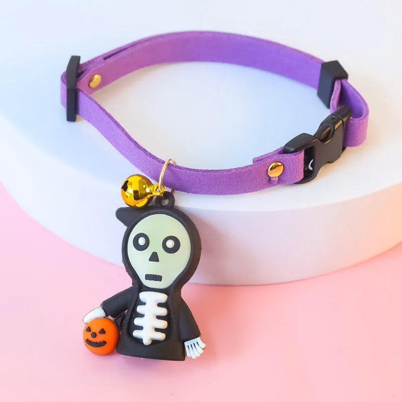 Halloween dog collar with pumpkin man and glow-in-the-dark skull designs in adjustable sizes.
