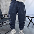 Man wearing blue bamboo fibre cropped sports trousers with a loose fit and high elasticity.