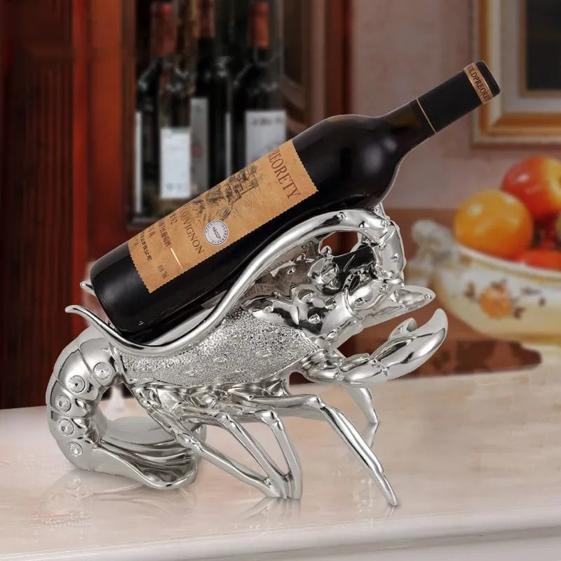 Lobster-shaped wine rack ornament in rose gold or elegant silver finish holding wine bottle