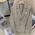Women's black loose fit polyester suit coat with long sleeves and pocket design