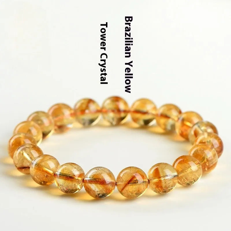 Natural yellow citrine gemstone bracelet showing geometric beads on a string.