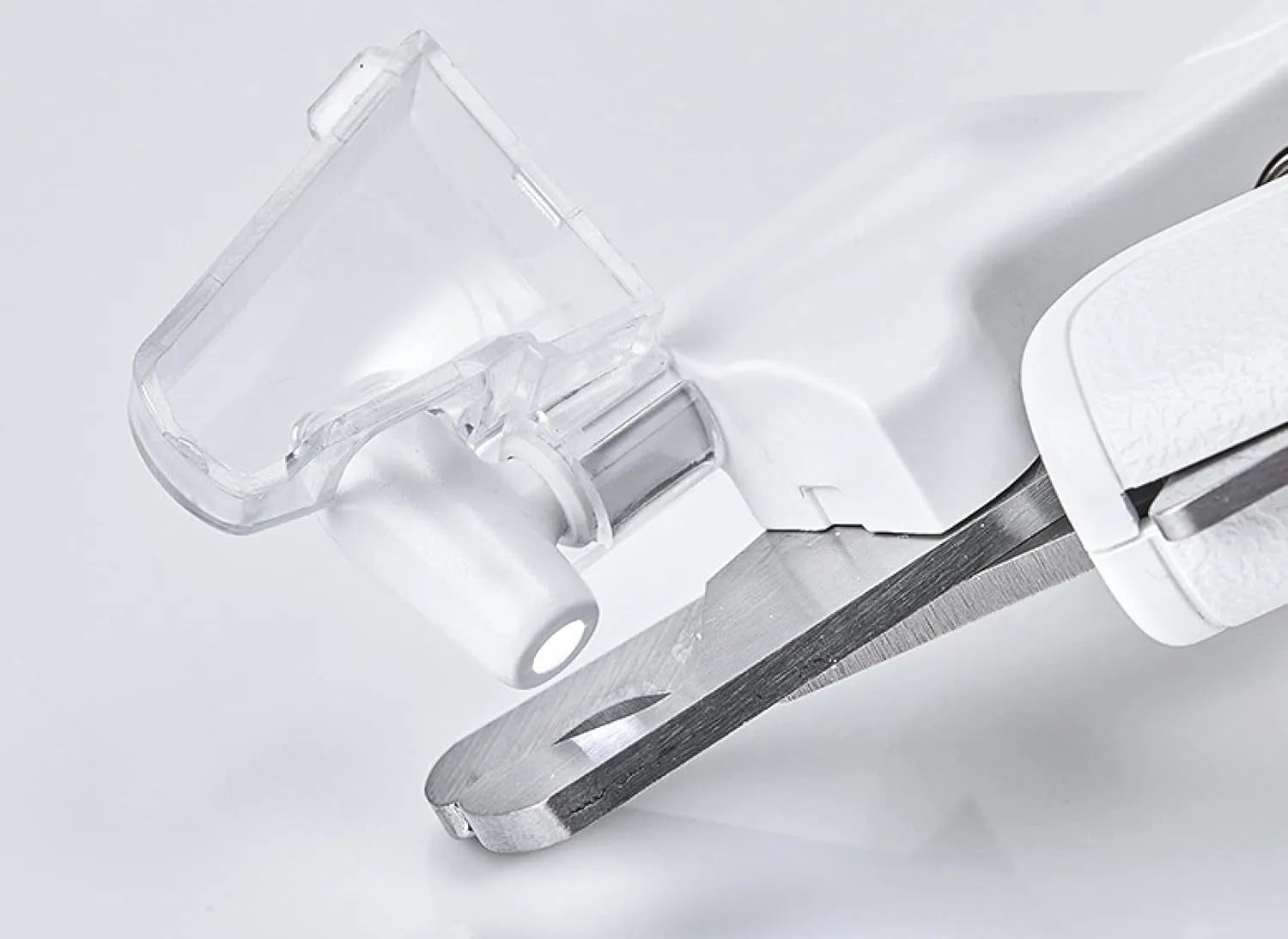 White LED pet nail clipper with a triangular blade, anti-splash guard, and leatherette handle.