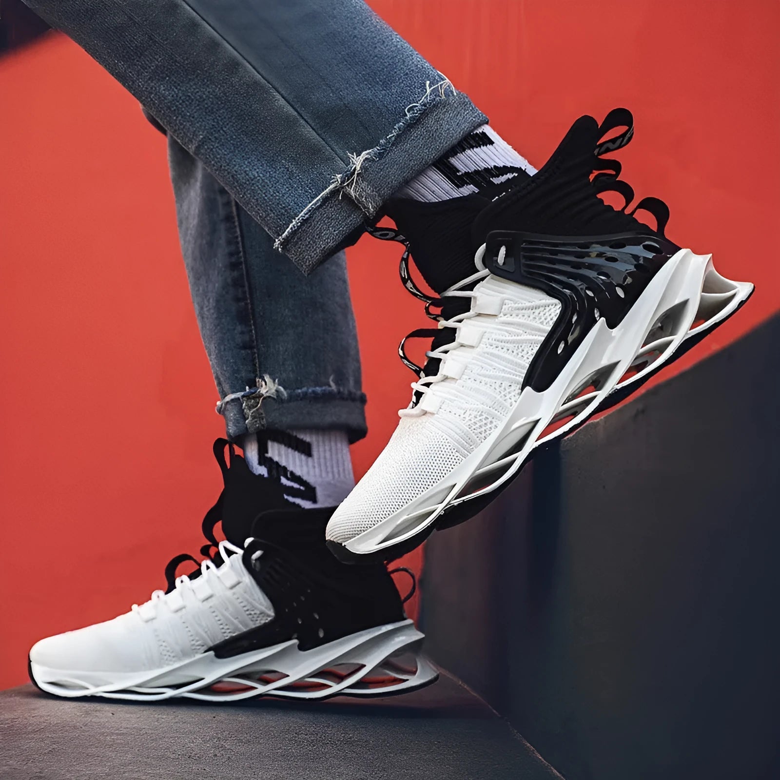 Men's flyknit blade sole mid-top sneakers in white and black colourway