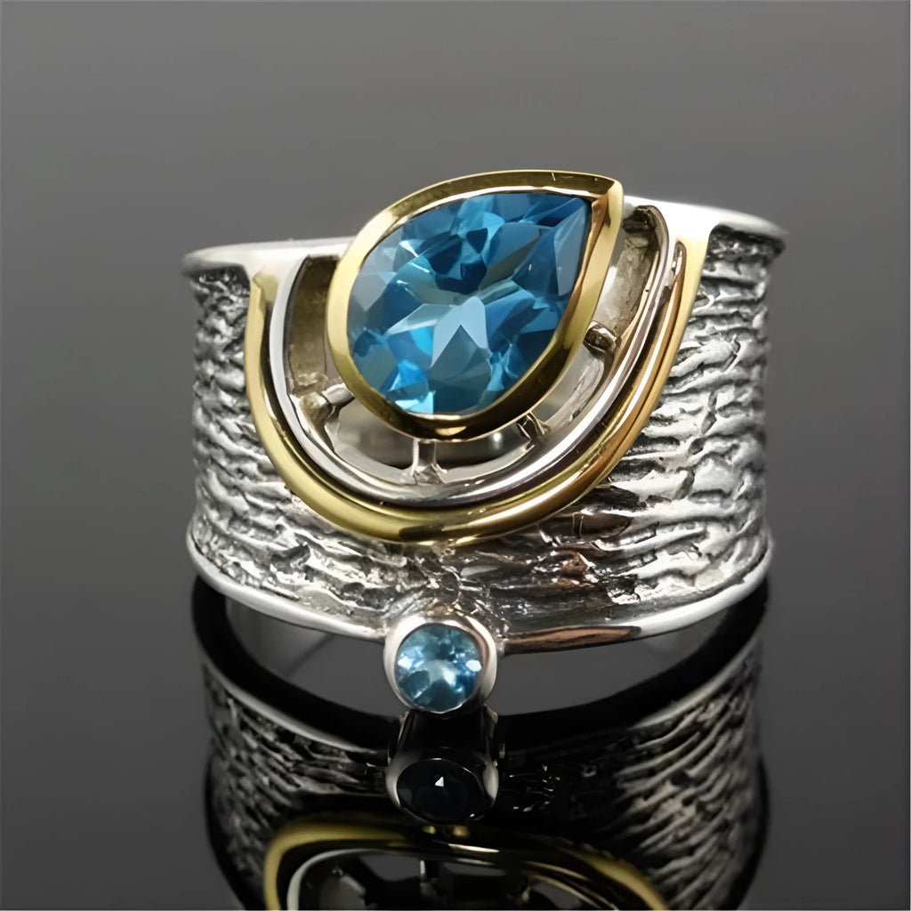 Blue zircon inlaid women's ring with Chinese style design and drop shape on alloy band