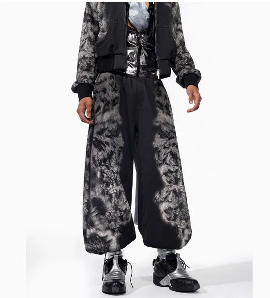 Loose fit streetwear co-ord set showing shorts, trousers, and hoodie with collage stitching detail
