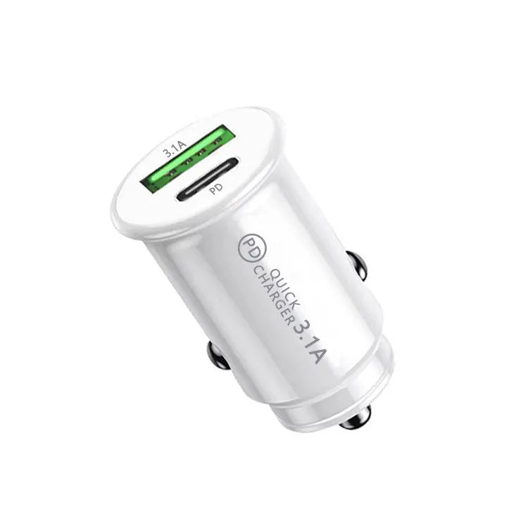 Black dual port car charger inserted in vehicle 12V socket with two USB cables connected