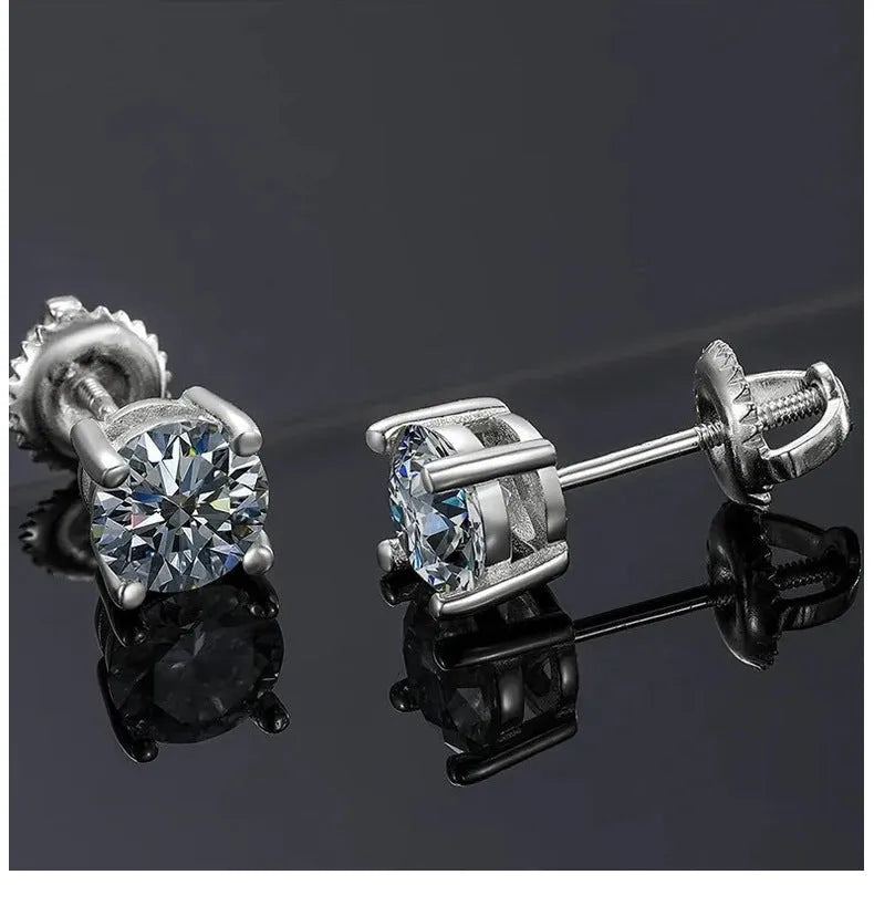 Close-up of silver geometric moissanite stud earrings with screw claw setting on a black card.