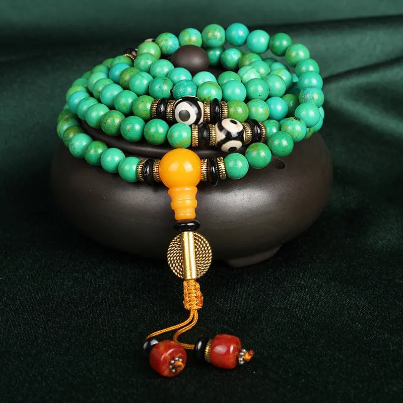Natural turquoise bracelet with 108 round polished 8mm beads on a string.