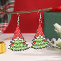 Printed wooden Christmas earrings with geometric Santa Claus designs in red and green