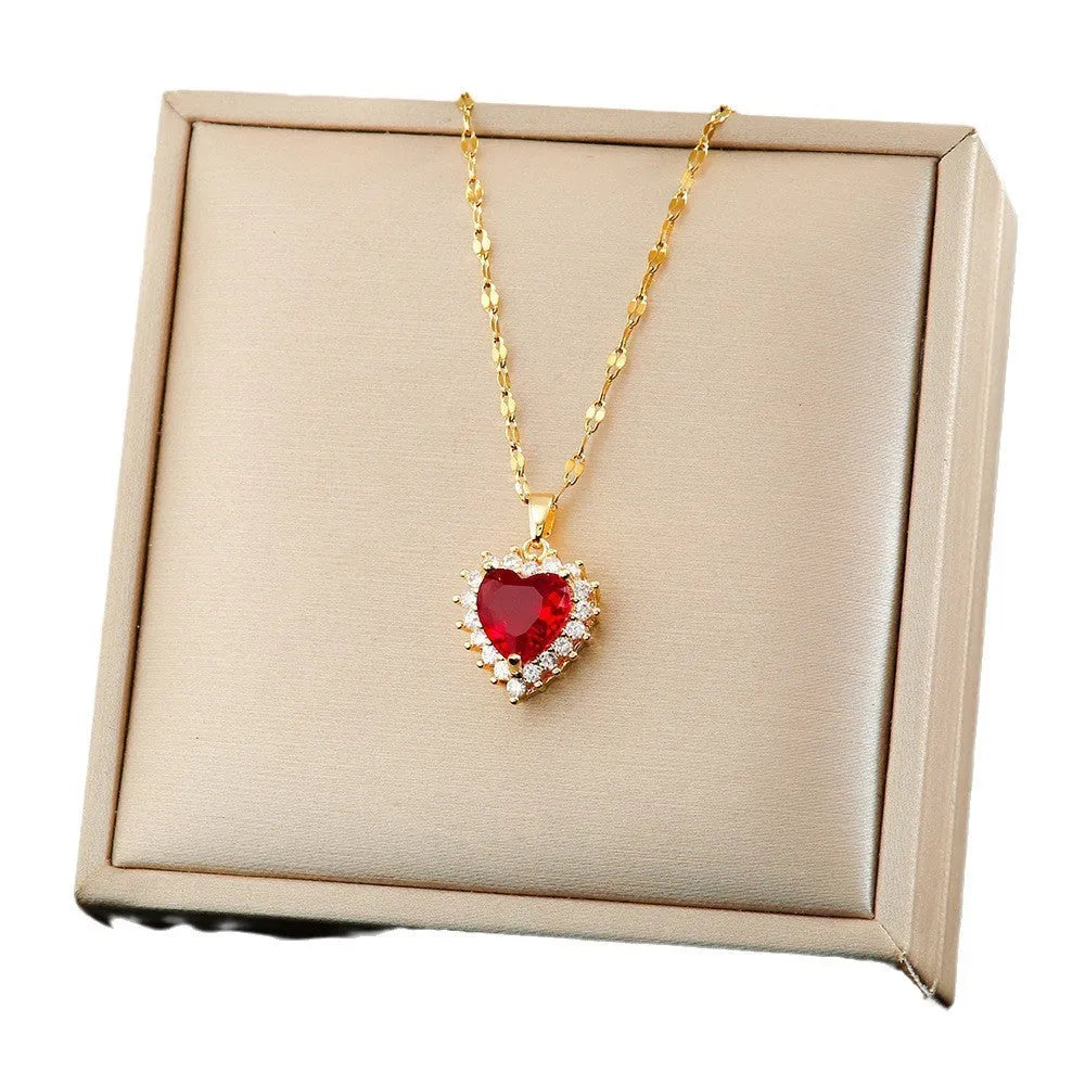 Gold-red titanium steel jewellery set with heart and flower pendant, matching earrings, and ring