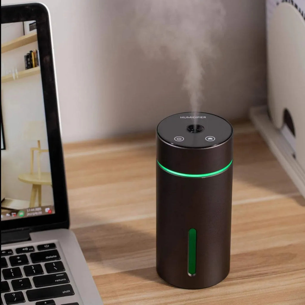 Aluminium portable car humidifier and essential oil diffuser with night light on a black USB cable.