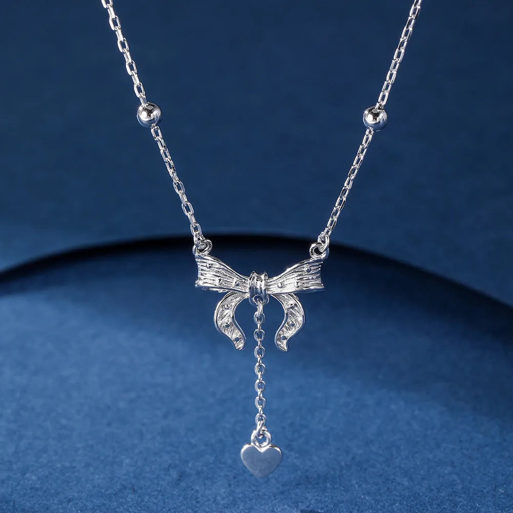 Silver butterfly heart pendant necklace on O-ring chain with adjustable length