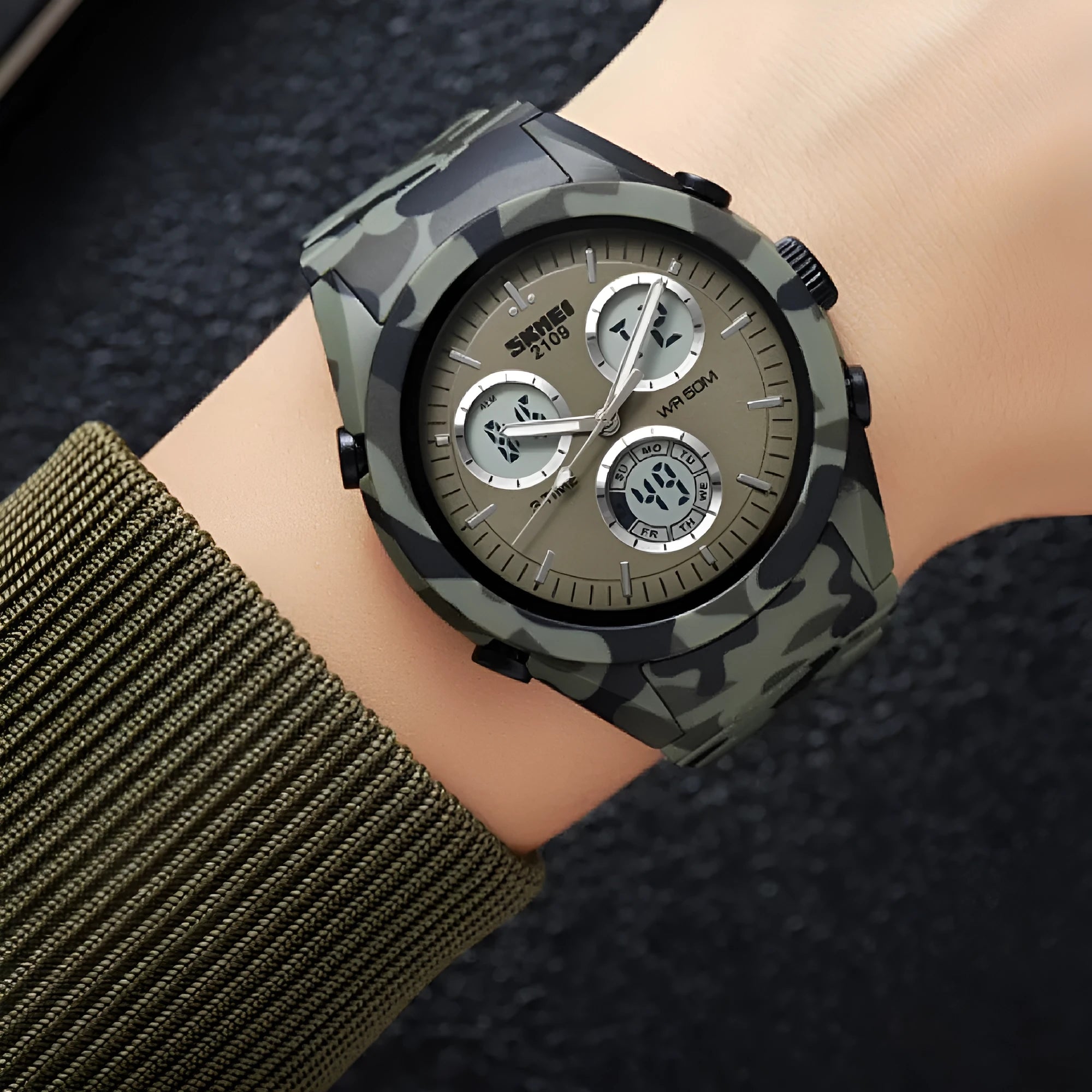 Digital casual watch with a black camouflage TPU strap and resin lens showing time on display.