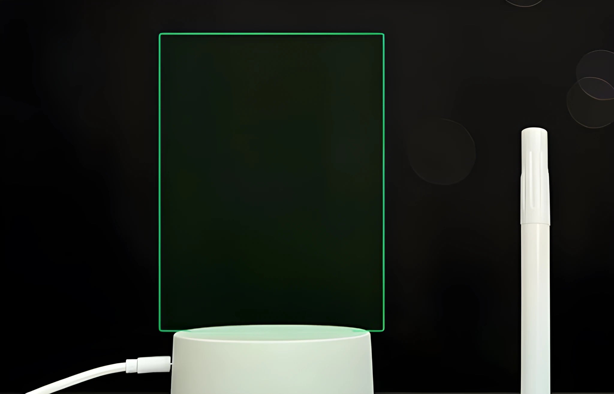 Black 3D acrylic LED message board night light with remote control and pen on desk