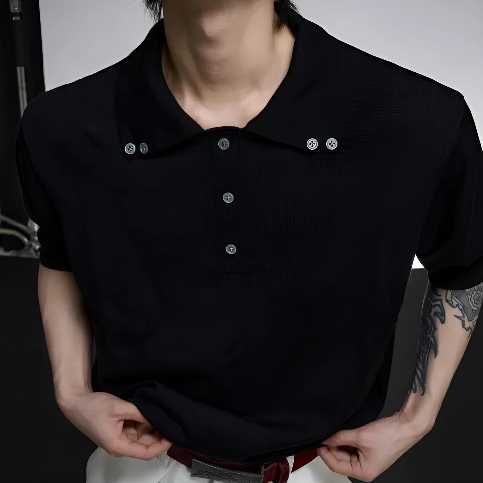 Man wearing a grey double collar lapel short sleeve polyester knit shirt in a loose fit