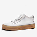 Men's black and white cowhide leather casual shoes with rubber soles and lace-up closure
