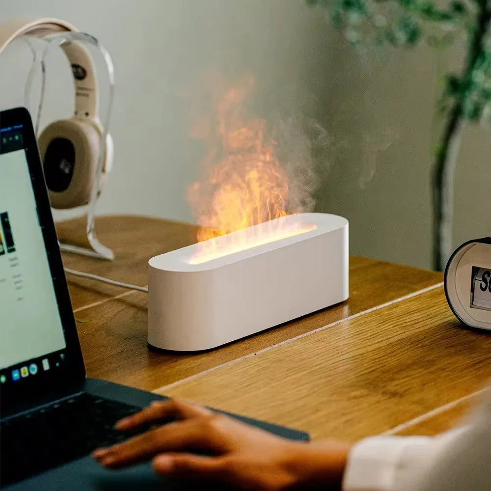 Square black creative lava flame USB desktop humidifier and essential oil diffuser on a desk.