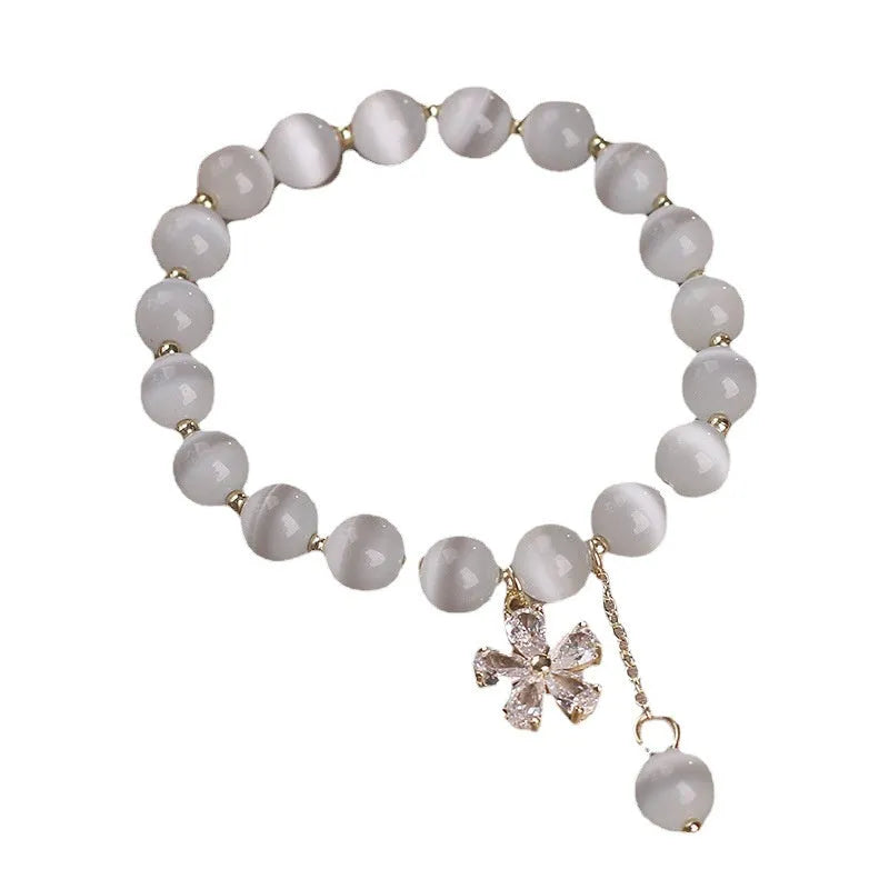 Women's white cat's eye stone bracelet with morganite safety buckle and flower tassel decoration