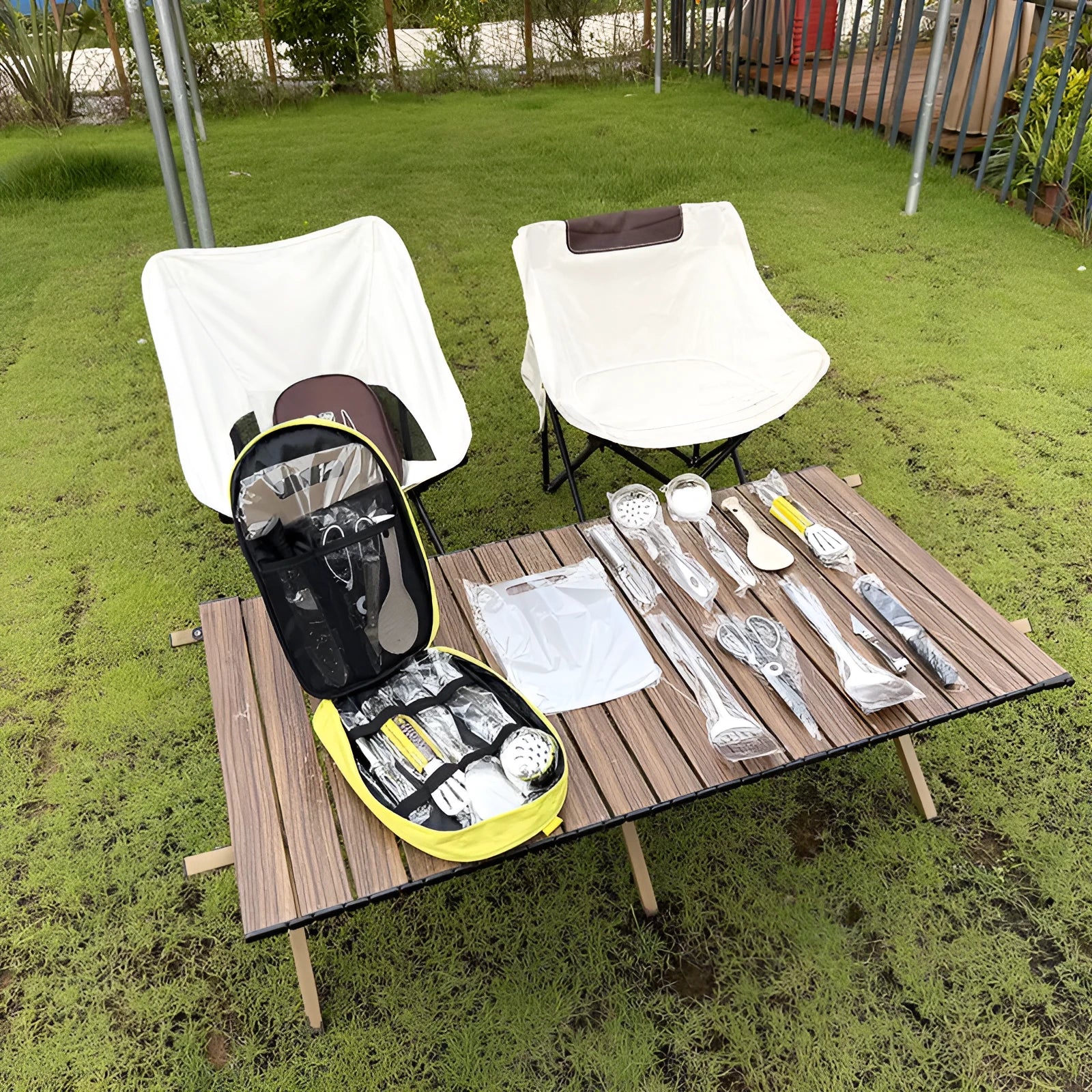 Picnic storage bag containing 12 stainless steel utensils for outdoor meals.