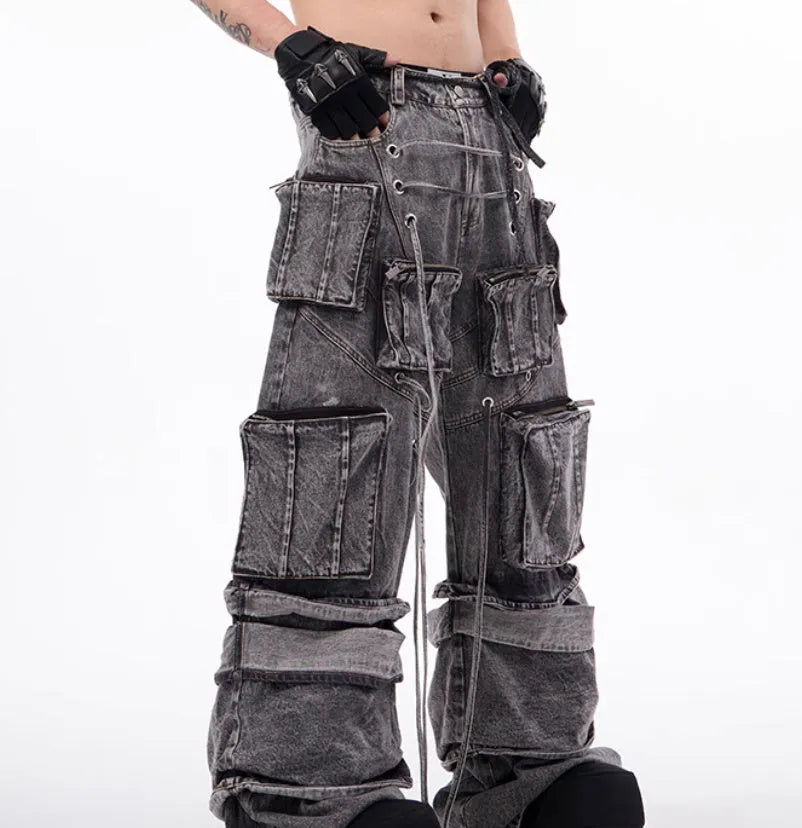 Grey distressed denim overalls with rope stitching detail on front