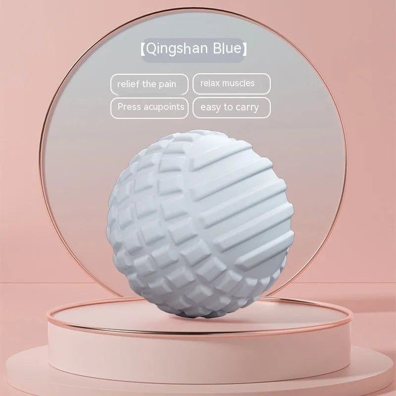 A 6cm diameter TPR foot massage ball shown in one of four colour options: pink, blue, green, or purple.