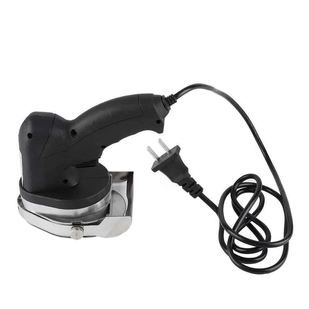 Black electric meat cleaver machine with EU plug and included cleaver accessory on a countertop.