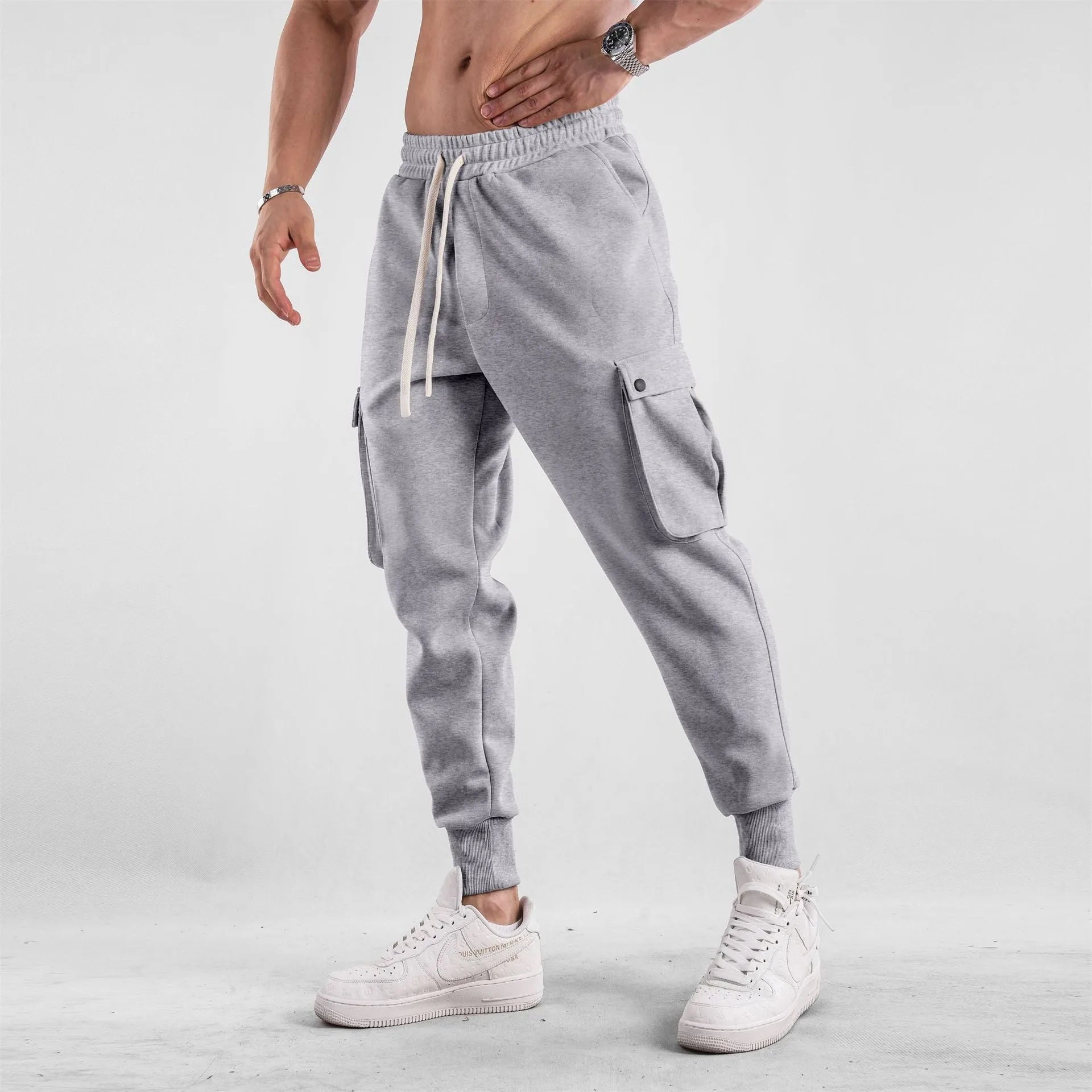 Men's loose cotton sports trousers with ankle ties and multiple pockets in various colour options