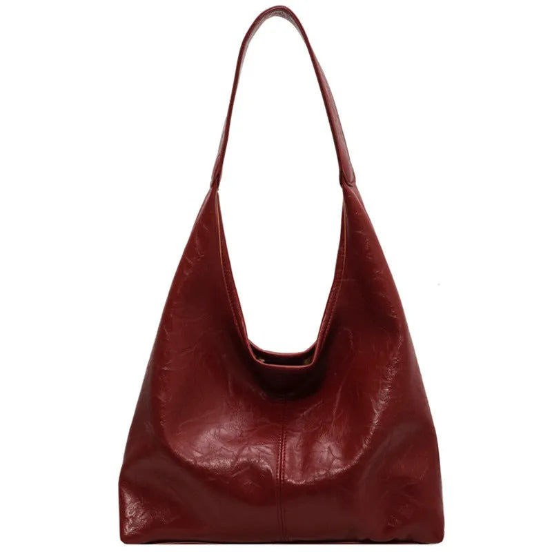 Soft PU leather shoulder bag with sewing thread accents and sandwich pocket design