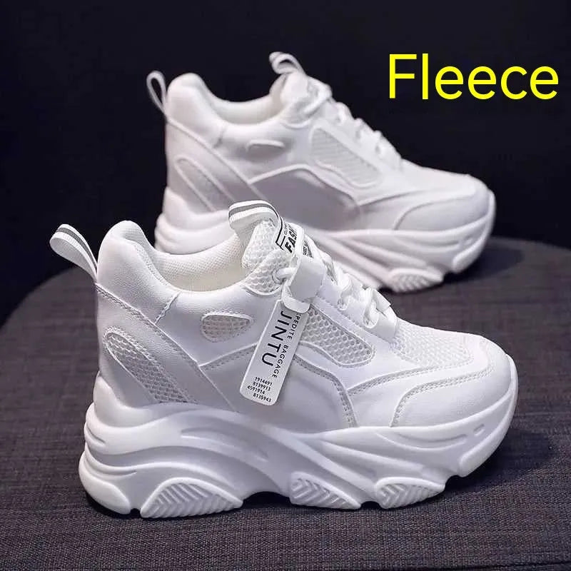 Men's black casual platform shoes with mesh upper and hollow out design on a white background.