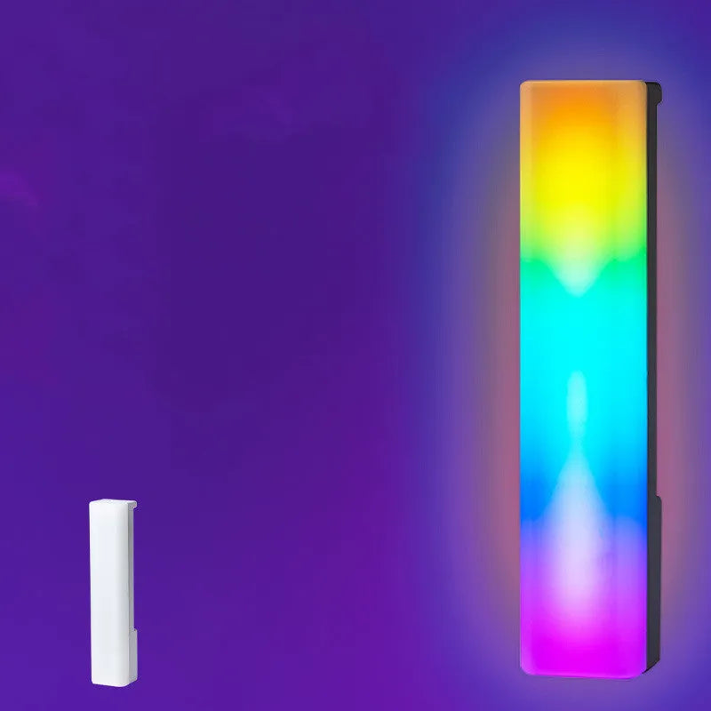 Tall 3D RGB LED ambience lamp with colourful lights on a desk, showcasing its voice-activated music rhythm mode.
