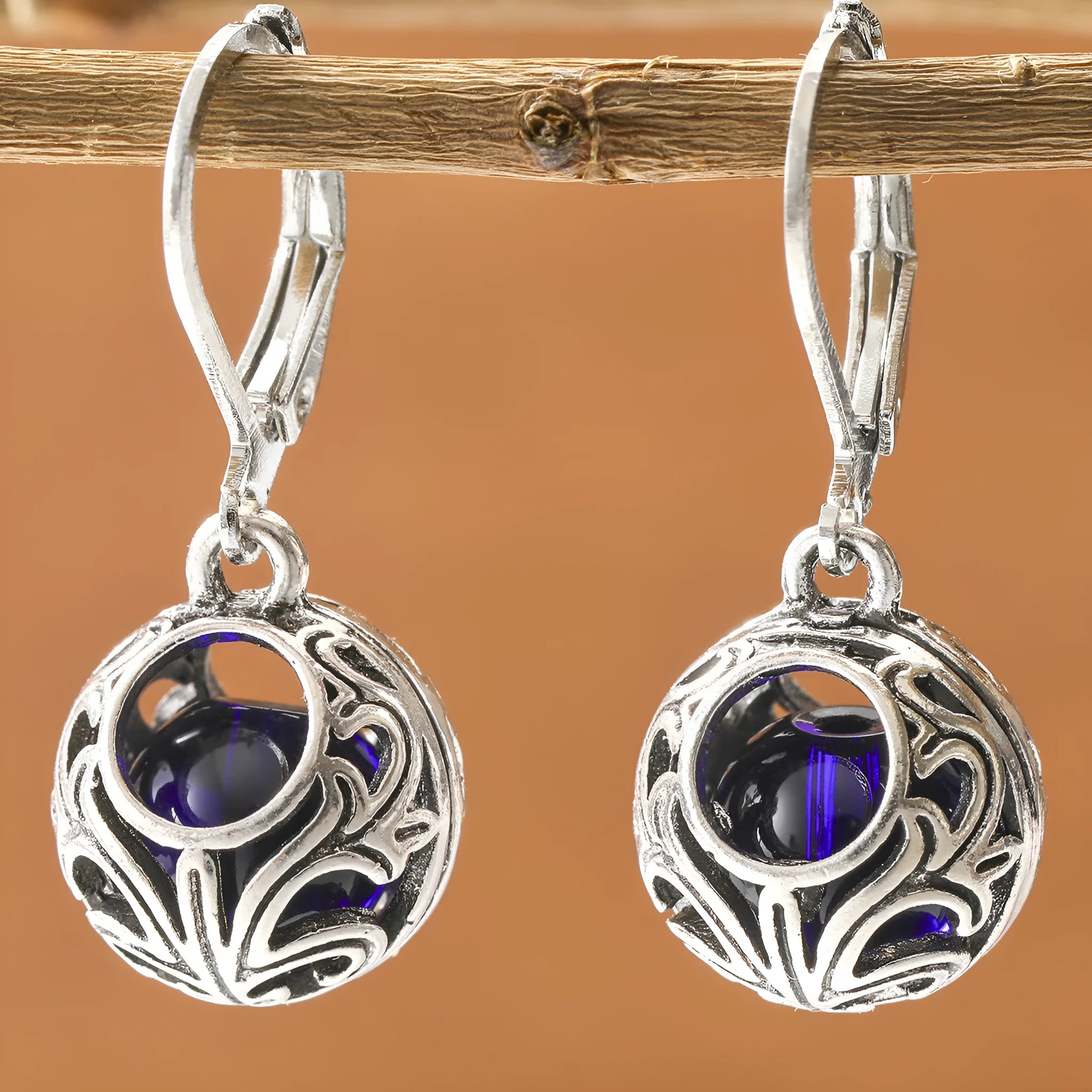 Silver geometric pendant earrings with vintage engraving and blue gemstone accents