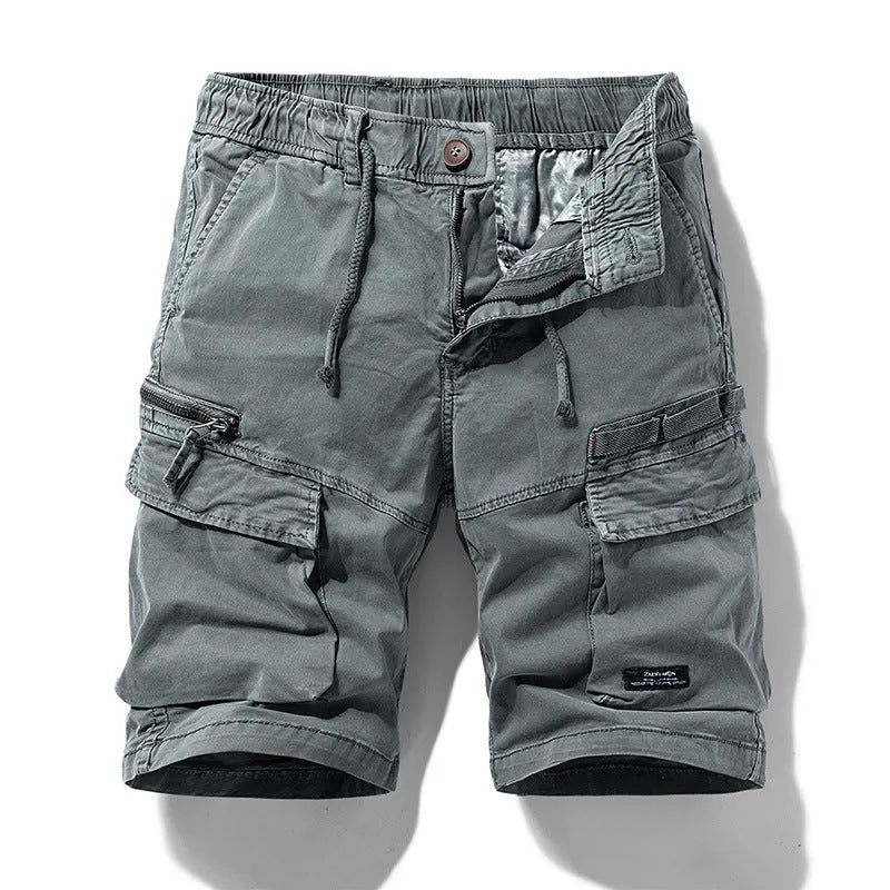 Men's army green cotton shorts with a zipper fly and multiple pockets, laid flat.