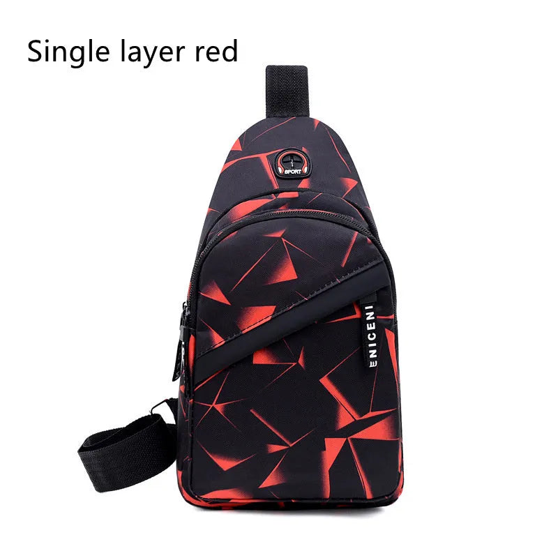 Men's blue Oxford cloth crossbody sling bag showing earphone hole and front zipper.