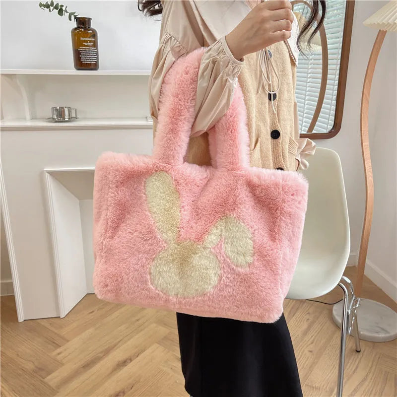 Cute cartoon rabbit ears plush shoulder tote bag in a solid colour.