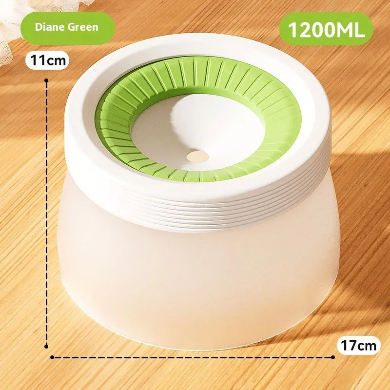 Green suspended pet water bowl for medium and small dogs and cats on a white plate