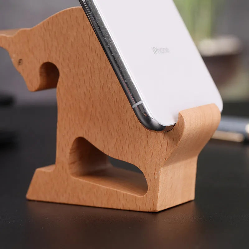 Decorative resin mobile phone stand in a choice of styles including animal figures and wood-effect designs.