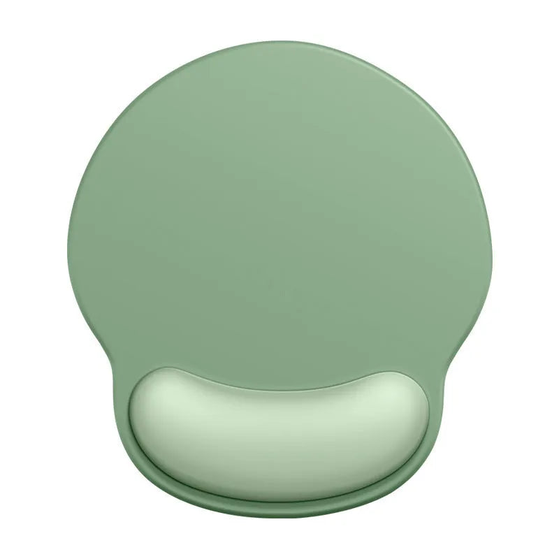 Silicone mouse mat with wristband in mint green colour on a desk