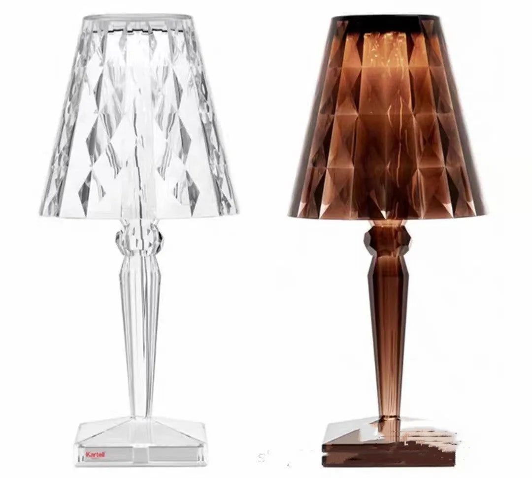 Rose gold portable touch control night light with dimming settings on a surface.