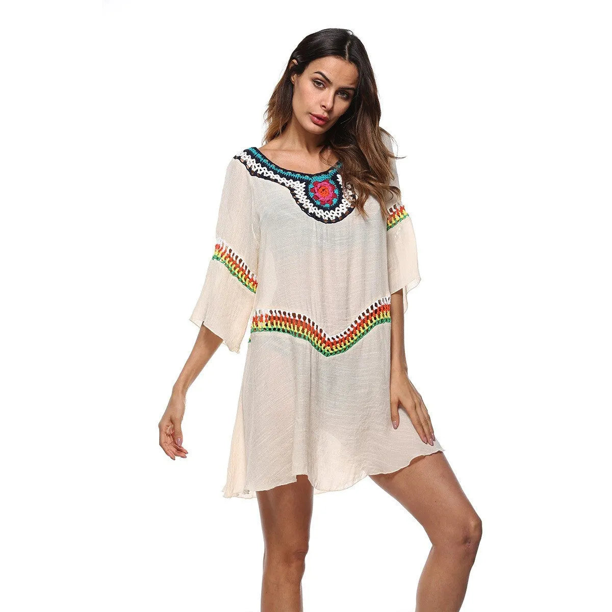 Women's crocheted white beach cover-up top for sun protection during swimming.