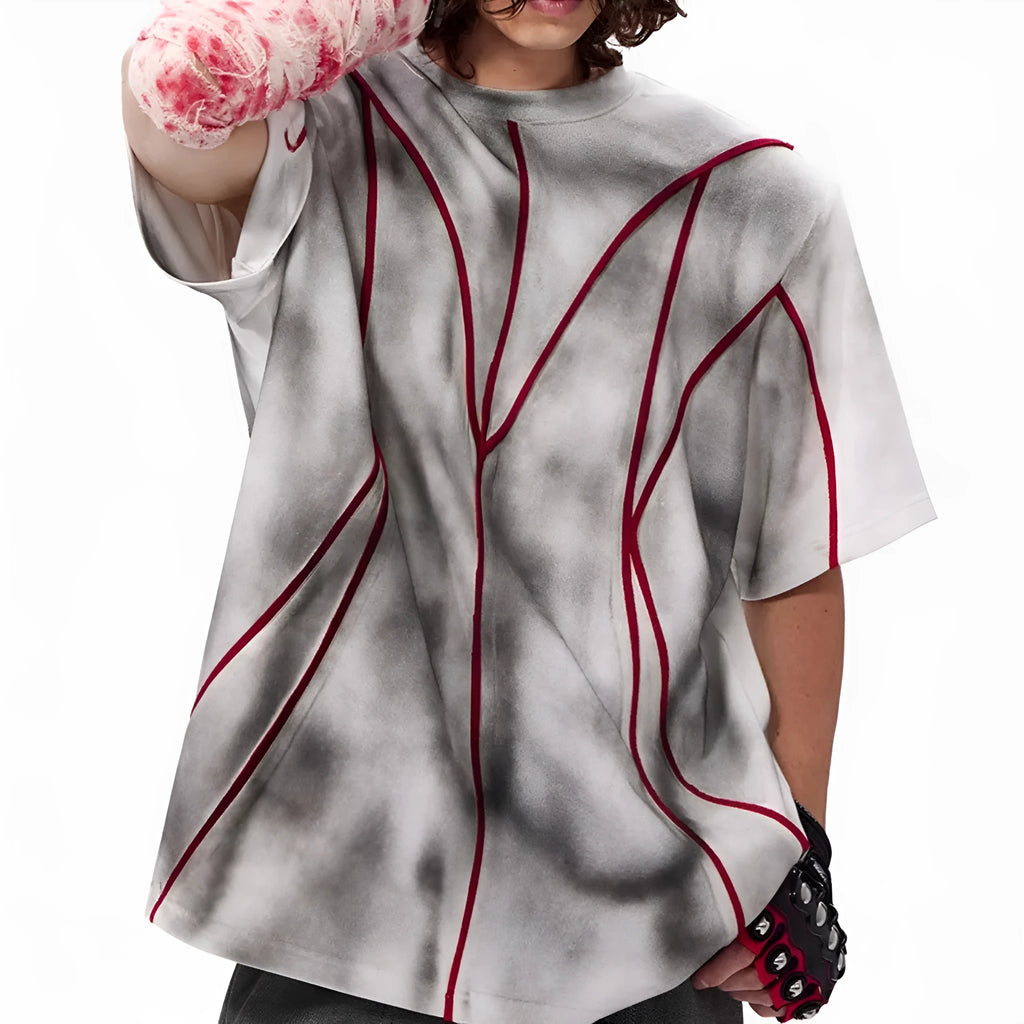 Padded shoulder short sleeve T-shirt with three-dimensional line patchwork on a round neck.