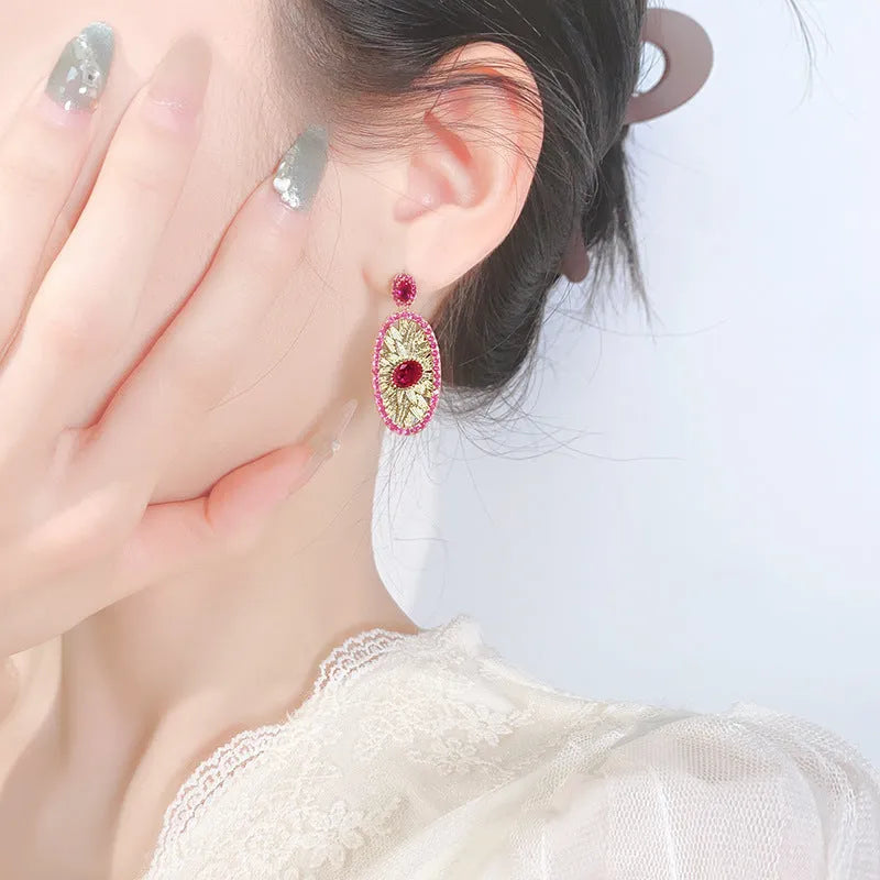 Gold-plated red corundum jewellery set showing necklace, ring and ear studs with diamond-cut water drop design