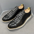 Low-top handmade men's shoes with an embossed pattern, shown in a choice of colours including black and green.