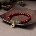 Handmade cinnabar and copper bracelet with wave shape design in national style