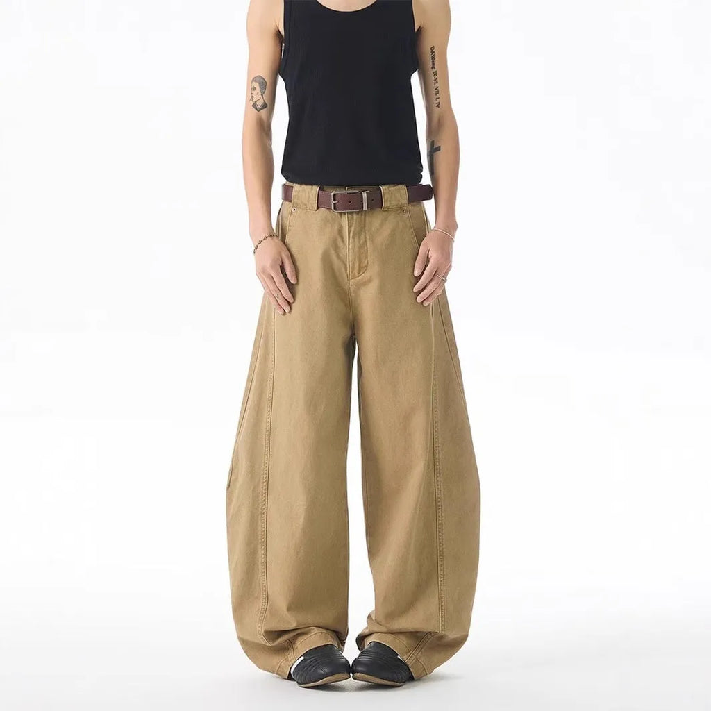 Brown men's loose fit straight leg denim jeans with a mid waist and button fly, shown laid flat.