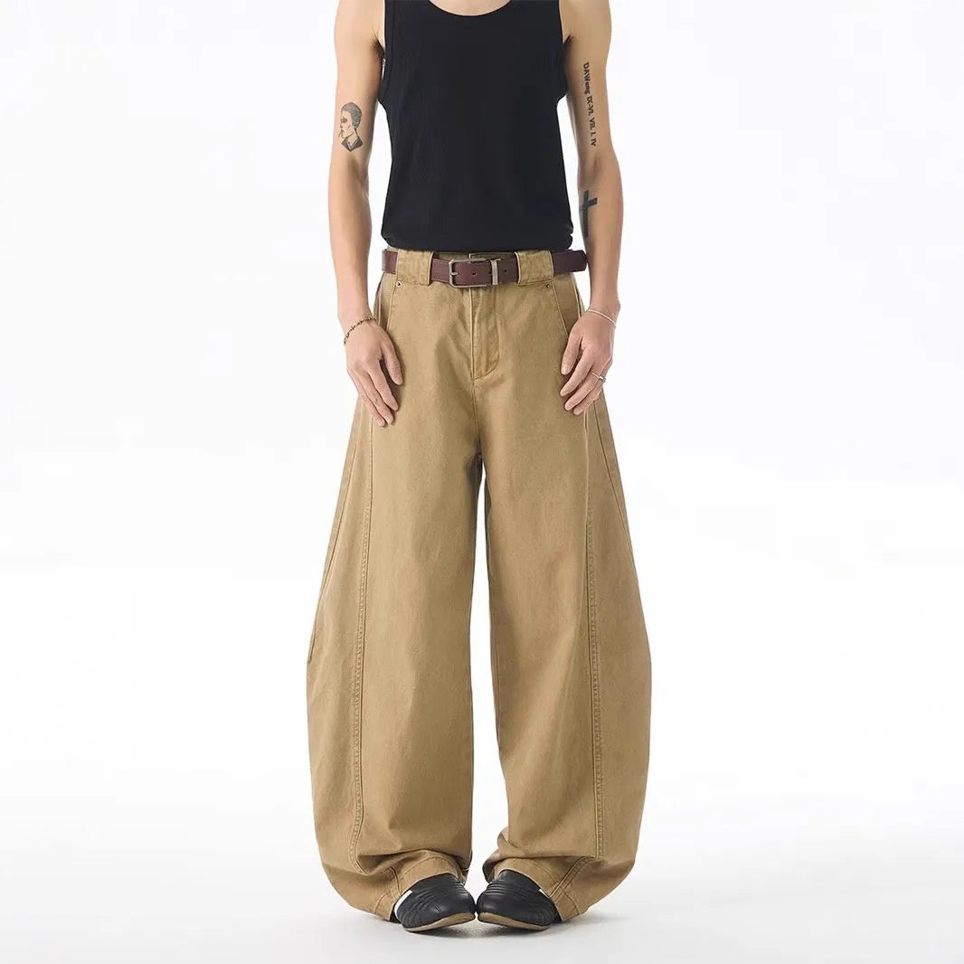 Brown men's loose fit straight leg denim jeans with a mid waist and button fly, shown laid flat.