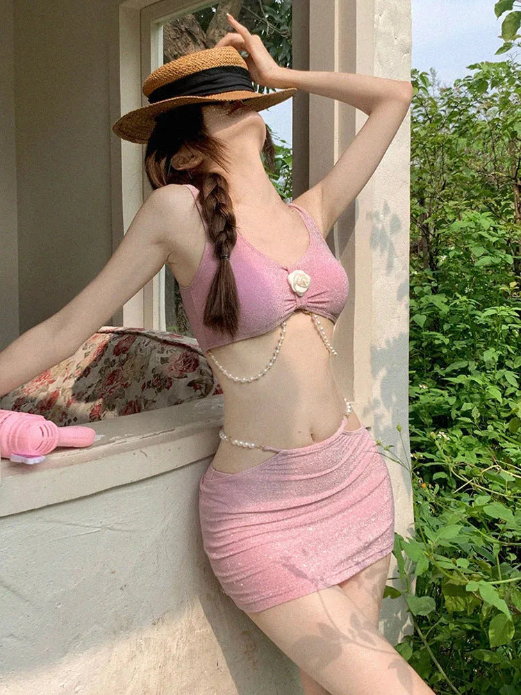 Bear Vacation brand three-piece bikini swimsuit for women in pink or black, showing briefs and sleeveless top.