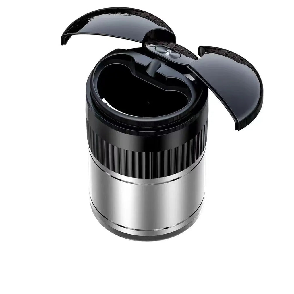 Black smart infrared metal car ashtray with lid on a car dashboard.